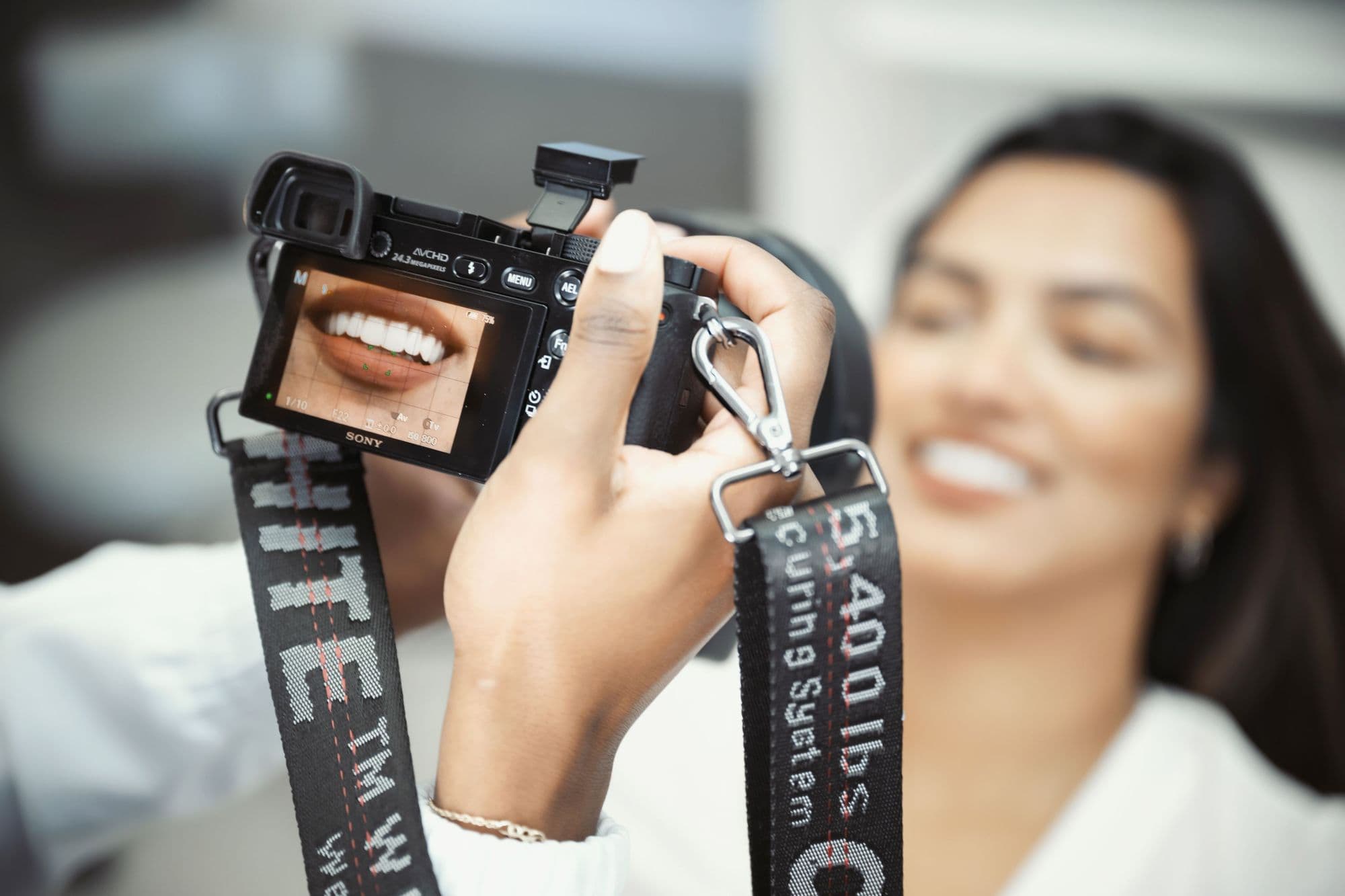 A camera displaying a patient's smile during a cosmetic dentistry photo session